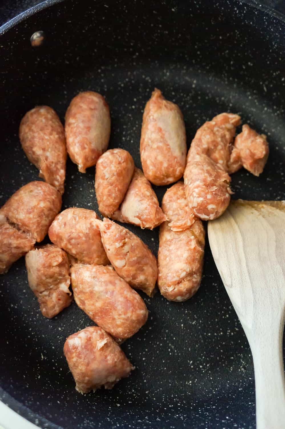 mild Italian sausage meat in a pan