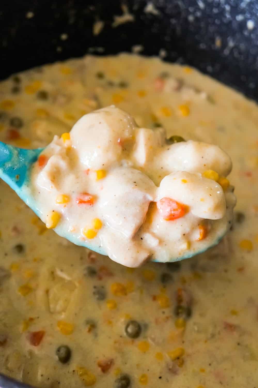 Chicken and Dumplings with Bisquick is a hearty comfort food dish loaded with pieces of chicken, carrots, peas, corn and dumplings made from Bisquick.