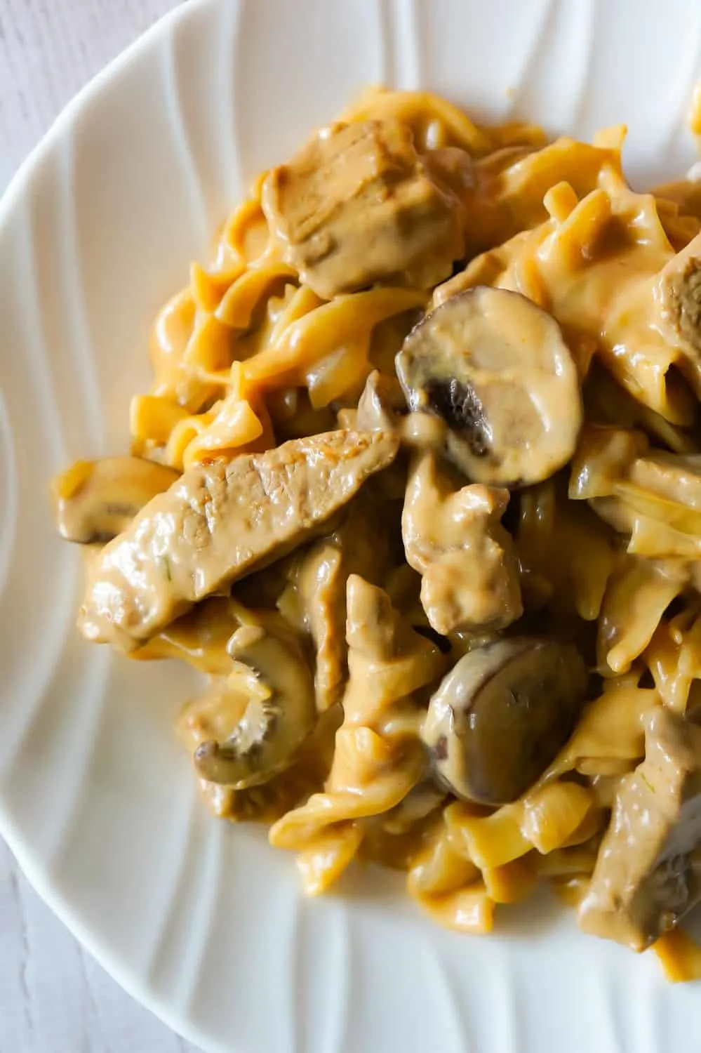 Easy Beef Stroganoff is a delicious one pot dinner recipe loaded with steak strips, onions, mushrooms and egg noodles in a sour cream and beef gravy sauce.