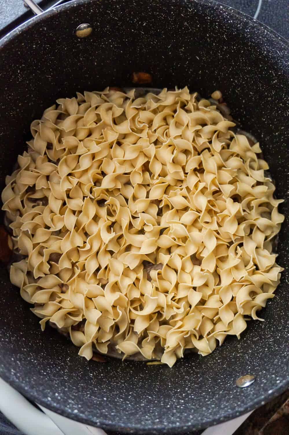 egg noodles in a large pan