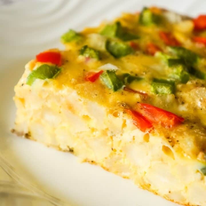 Egg Casserole with Hash Browns is a an easy breakfast recipe made with diced hash brown potatoes and loaded with onions, green peppers and red peppers.