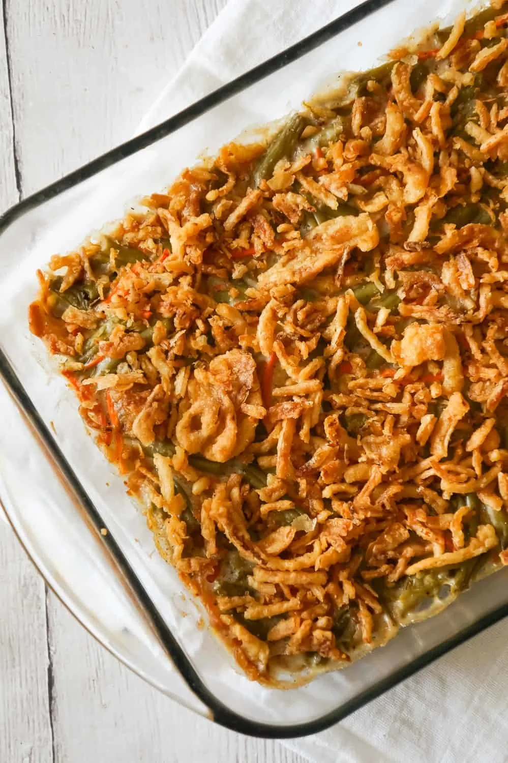 Green Bean Casserole with Campbell's Soup is a simple and delicious side dish recipe made with canned green beans, matchstick carrots, cream of mushroom soup and French's fried onions.