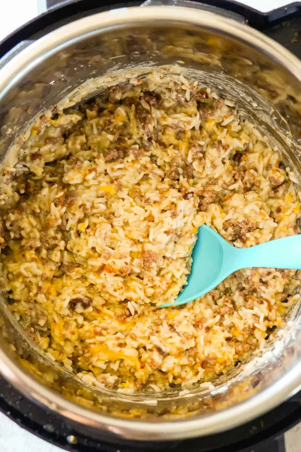 Instant Pot Bacon Cheeseburger Rice is a delicious pressure cooker dinner recipe using hamburger meat and loaded with long grain rice, crumbled bacon and cheese.