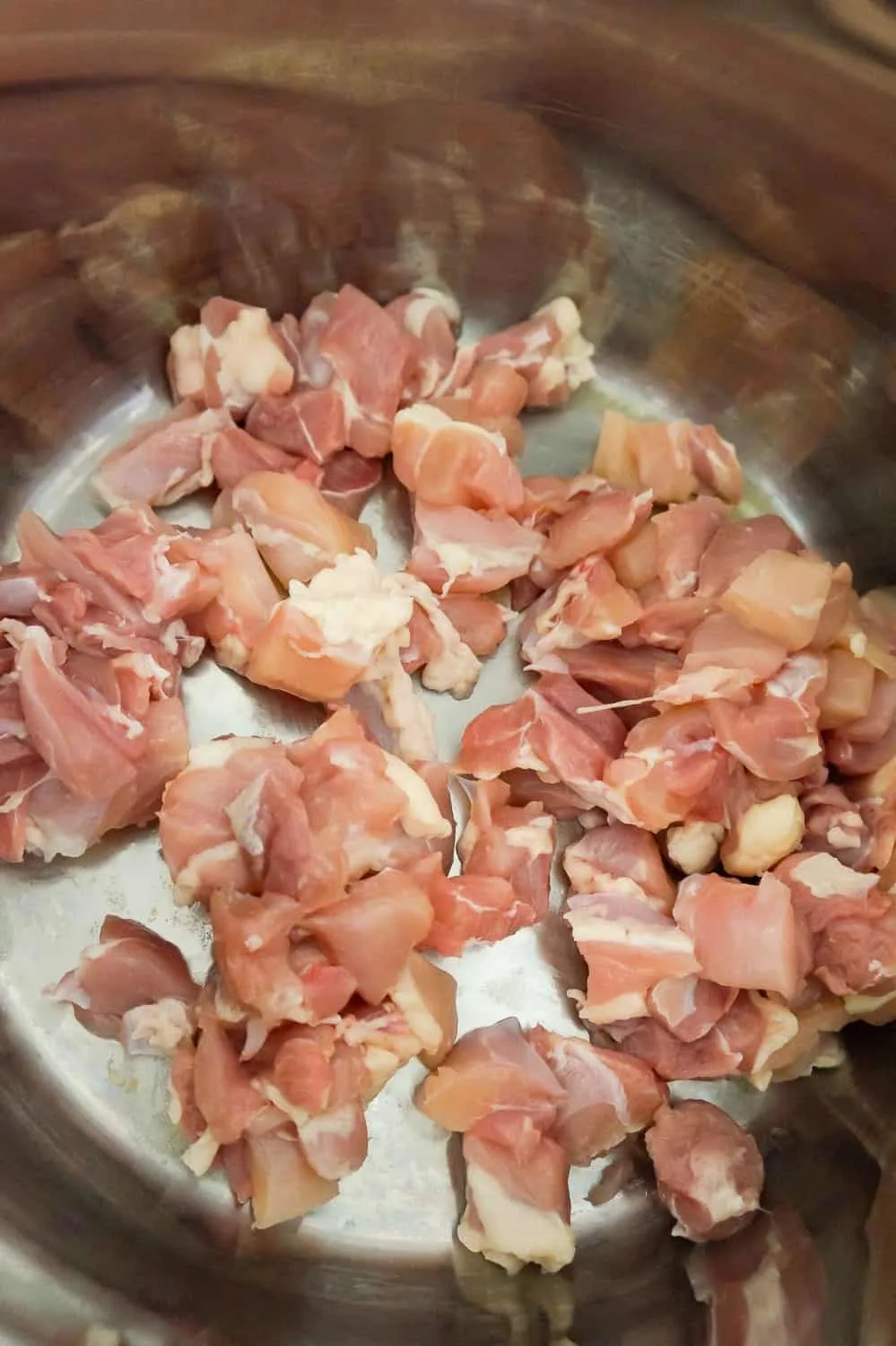 raw chicken pieces in an Instant Pot