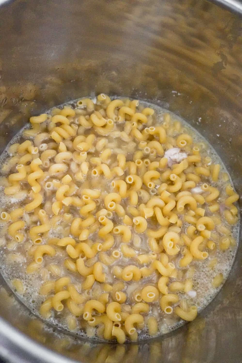 chicken chunks, chicken broth and cavatappi noodles in an Instant Pot