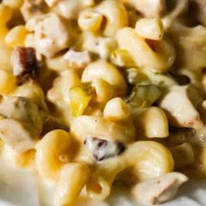 Instant Pot Cheesy Dill Pickle Chicken Pasta is an easy pressure cooker pasta recipe loaded with chunks of chicken, chopped dill pickle, crumbled bacon, cheddar, mozzarella and ranch dressing.