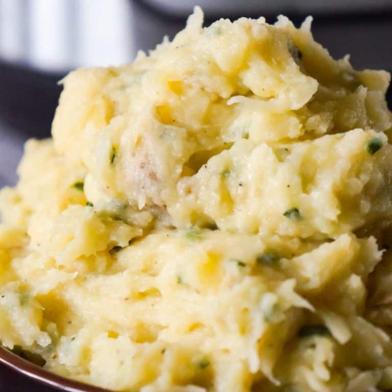 Instant Pot Garlic Parmesan Mashed Potatoes are creamy mashed potatoes loaded with garlic, fresh chives and grated Parmesan cheese.