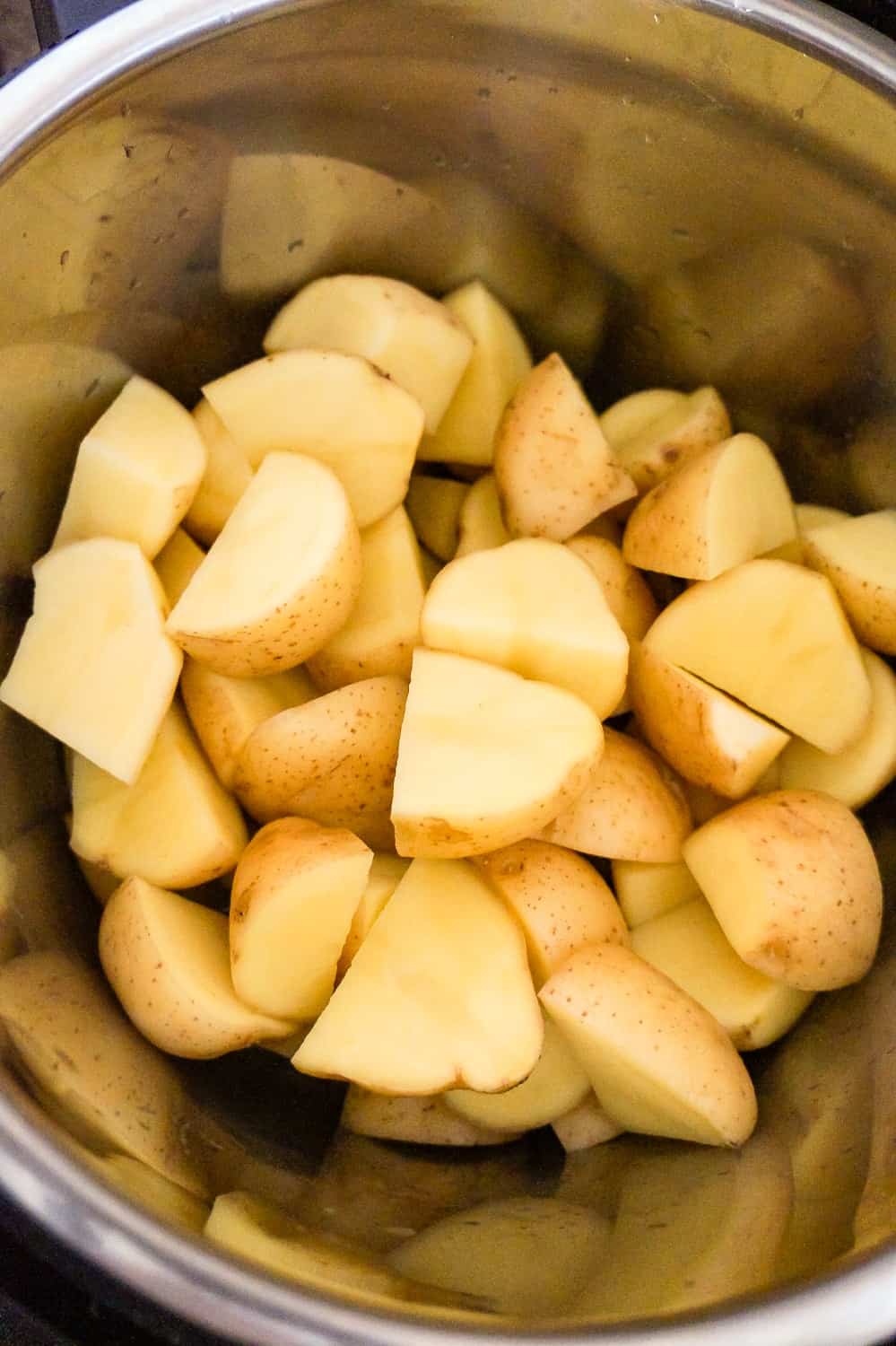 raw potato quarters in an Instant Pot