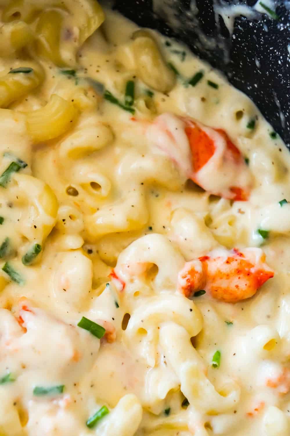 Lobster Mac and Cheese is a delicious seafood pasta recipe made with chunks of precooked lobster, mozzarella, cheddar and Swiss cheese.