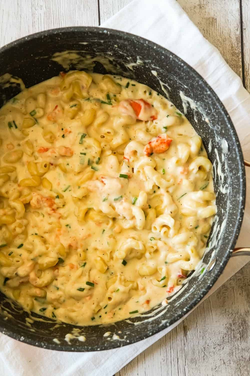 Lobster Mac and Cheese is a delicious seafood pasta recipe made with chunks of precooked lobster, mozzarella, cheddar and Swiss cheese.