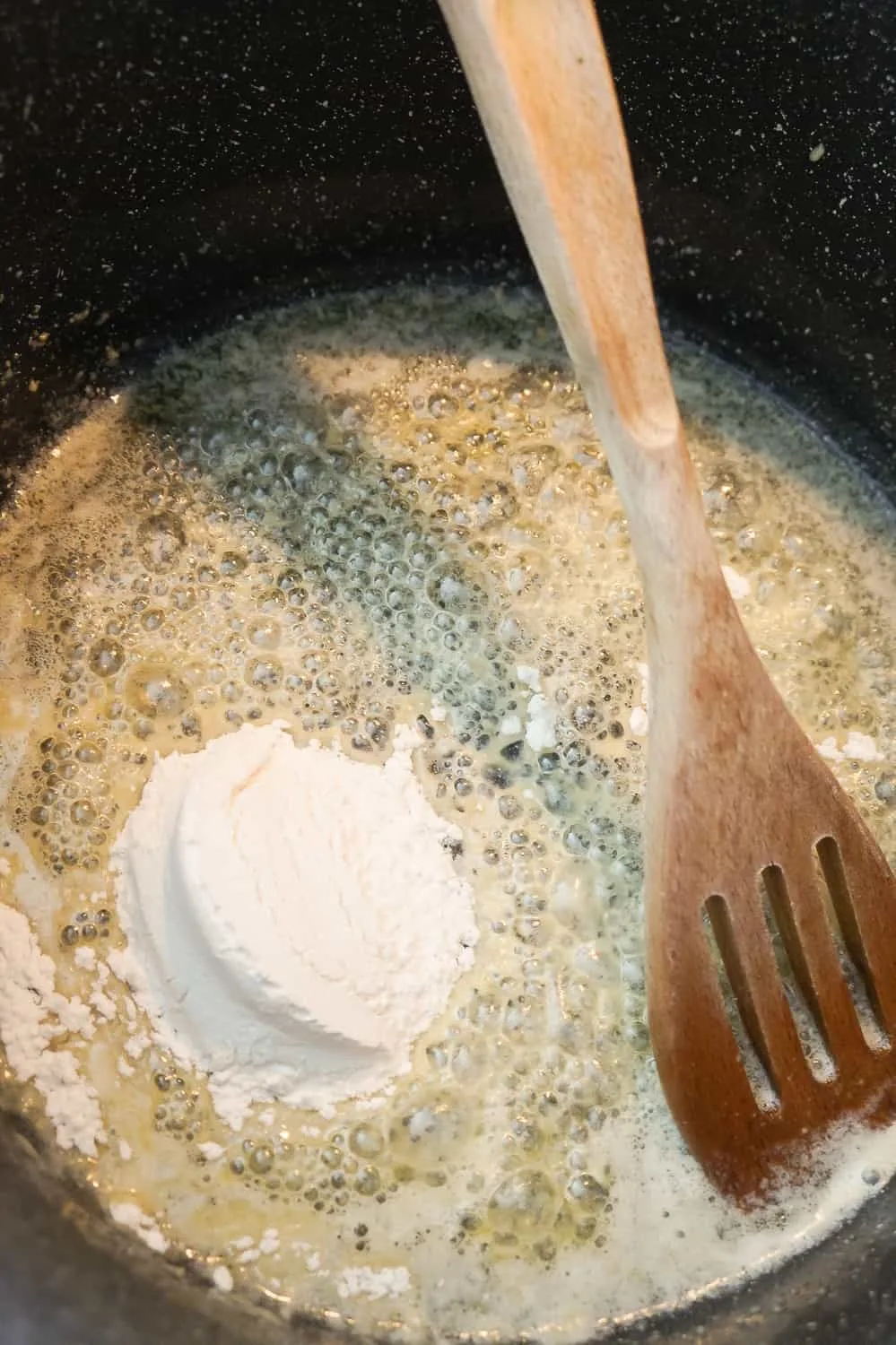 all purpose flour on top of melted butter in a large pot