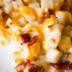 Cheesy Potato Casserole with Bacon is a delicious side dish recipe made with frozen diced hash brown potatoes, Campbell's condensed cream of bacon soup, shredded mozzarella, cheddar and crumbled bacon.