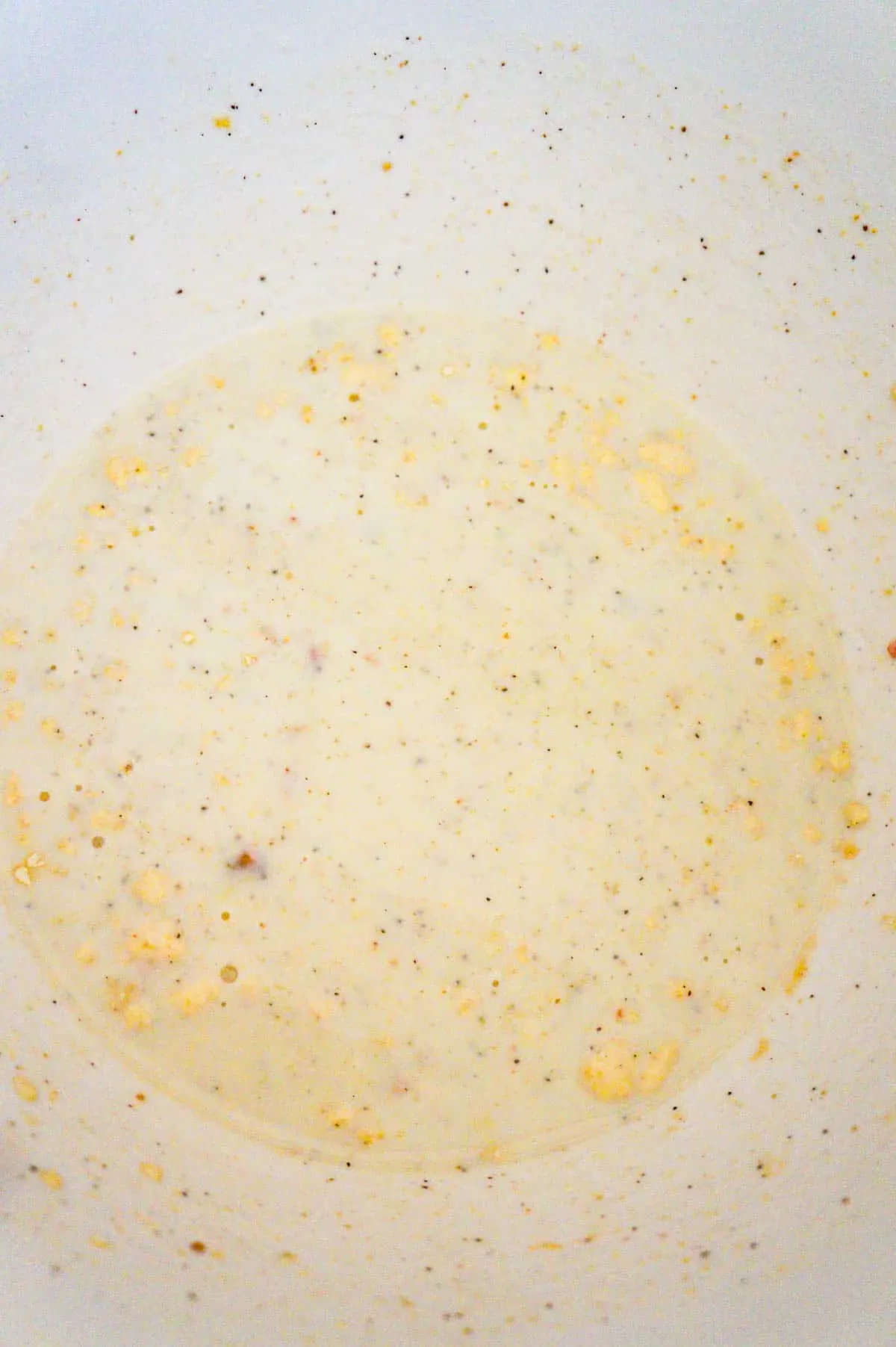 cream of bacon soup and milk mixture in a mixing bowl