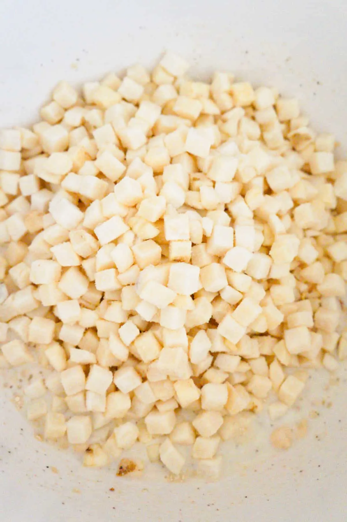diced frozen hash brown potatoes in a mixing bowl