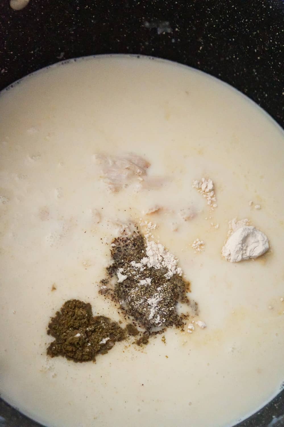 spices added to creamy turkey soup