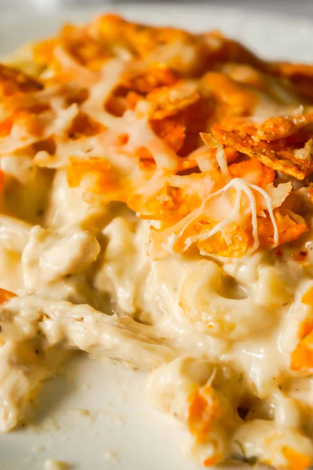 Doritos Mac and Cheese Casserole with Chicken is an easy dinner recipe that combines cheesy pasta, rotisserie chicken and Doritos nacho chips.