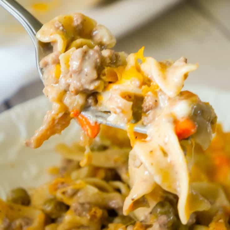 Hamburger Noodle Casserole is an easy ground beef casserole recipe loaded with egg noodles, veggies, cheese and crispy fried onions.