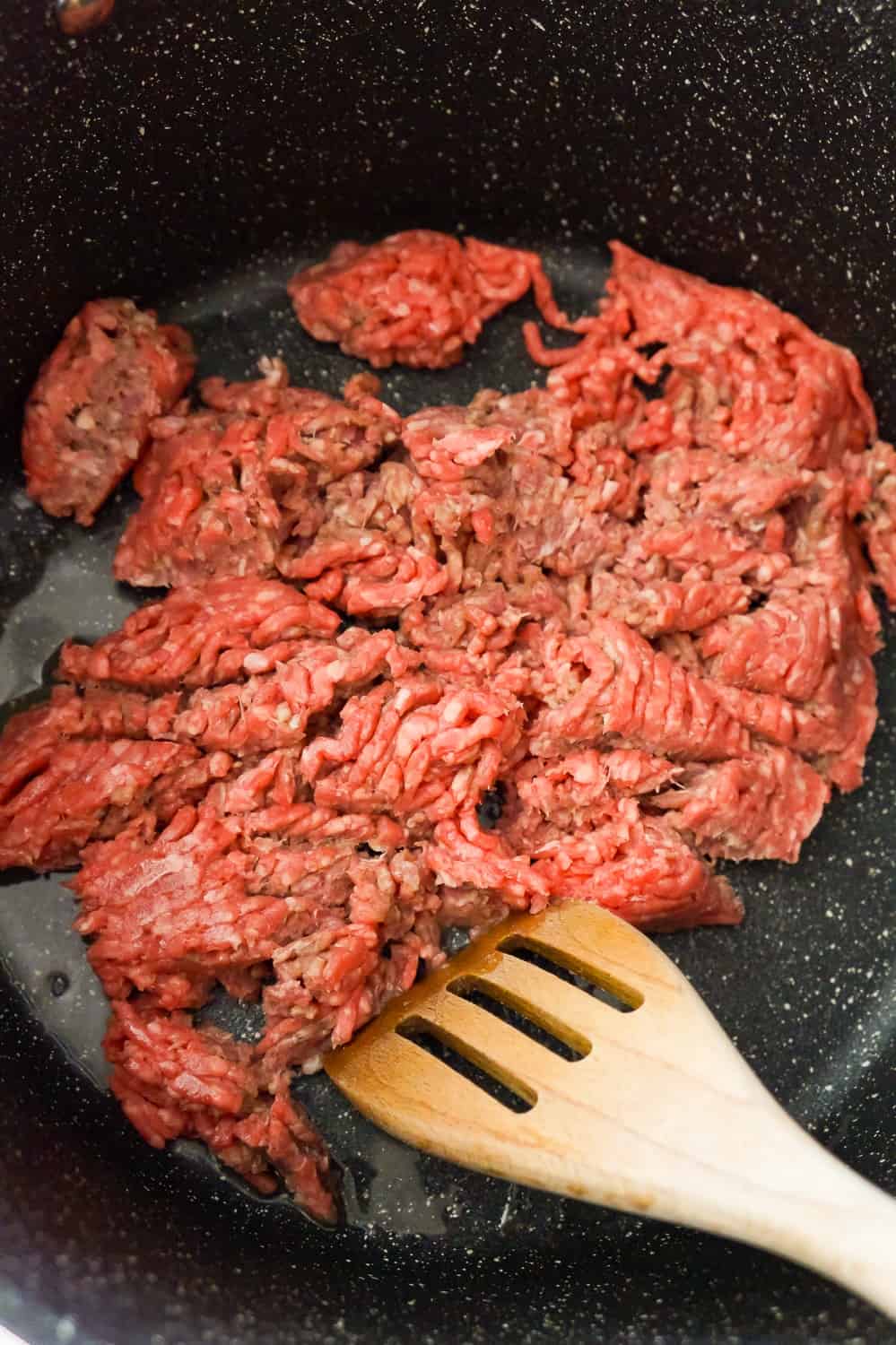 raw ground beef in a large pot