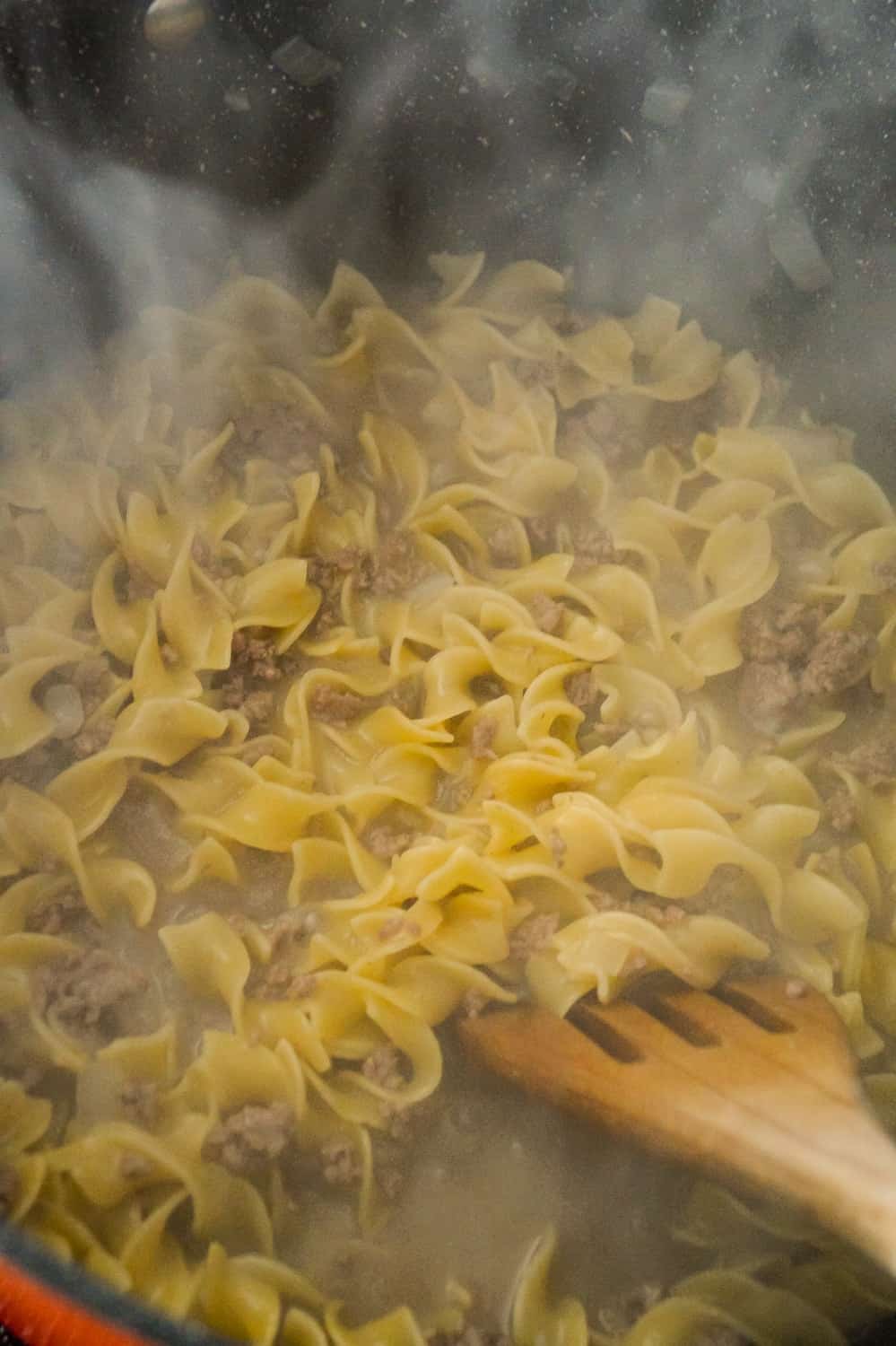 egg noodles and ground beef in a large pot