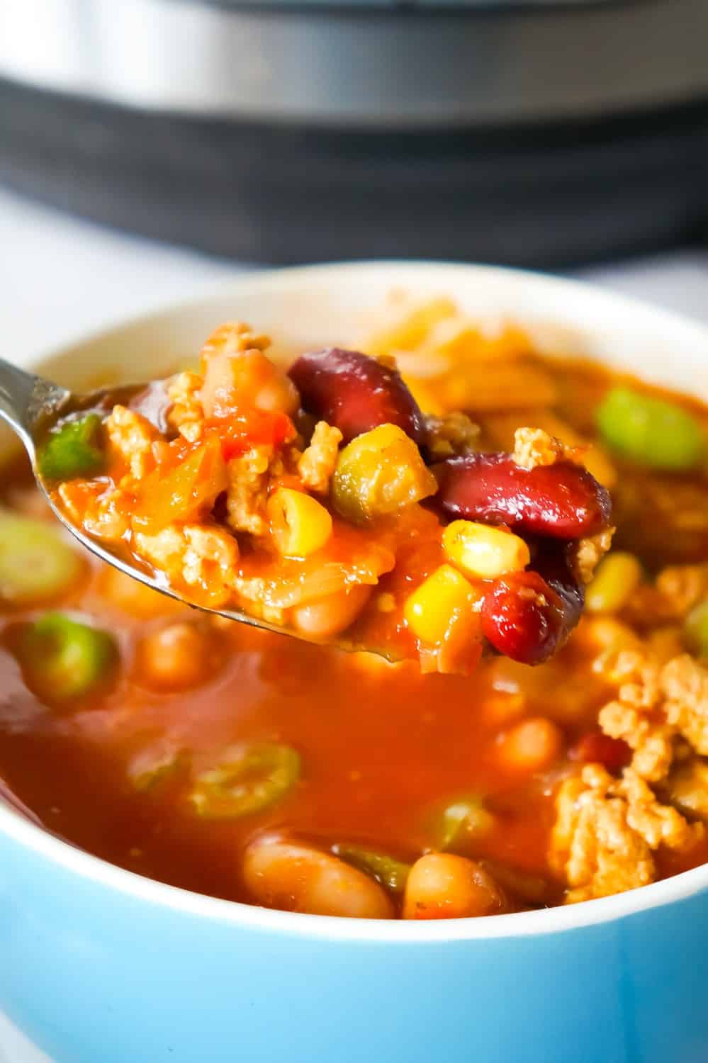 Instant Pot Turkey Chili is an easy pressure cooker chili recipe using ground turkey, chunky salsa, chili sauce, mixed beans and taco seasoning.