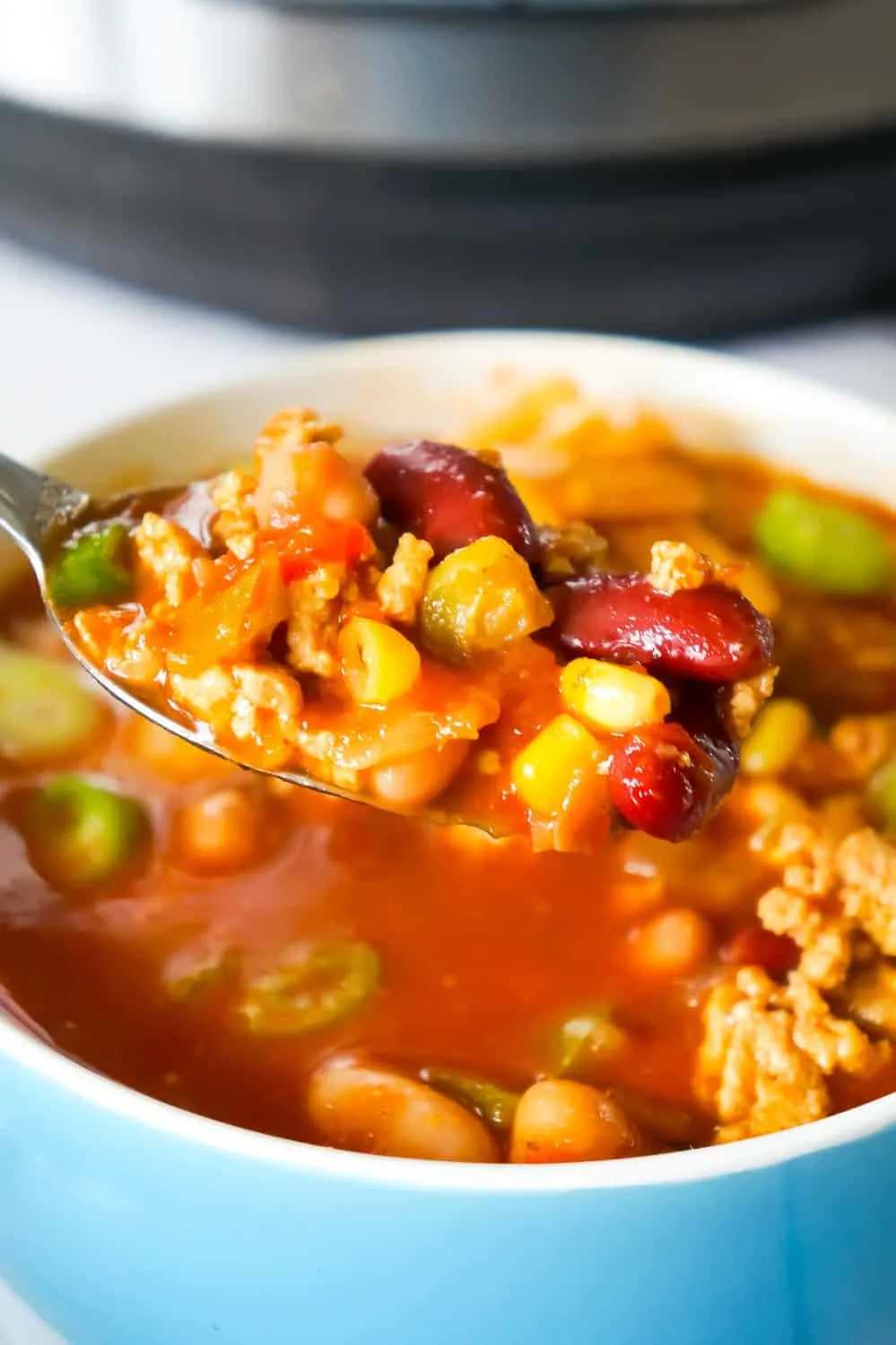 Instant Pot Turkey Chili is an easy pressure cooker chili recipe using ground turkey, chunky salsa, chili sauce, mixed beans and taco seasoning.