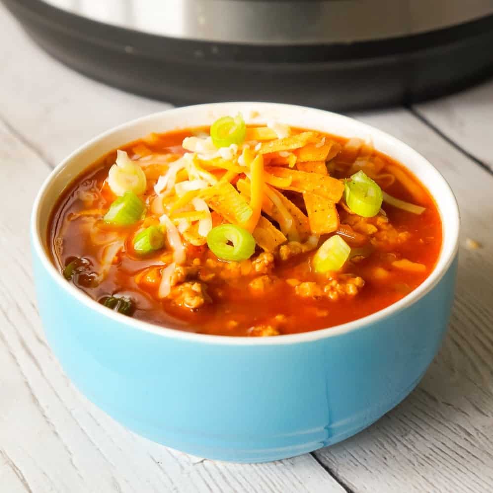 Instant Pot Turkey Chili is an easy pressure cooker chili recipe using ground turkey, chunky salsa, chili sauce, mixed beans and taco seasoning.