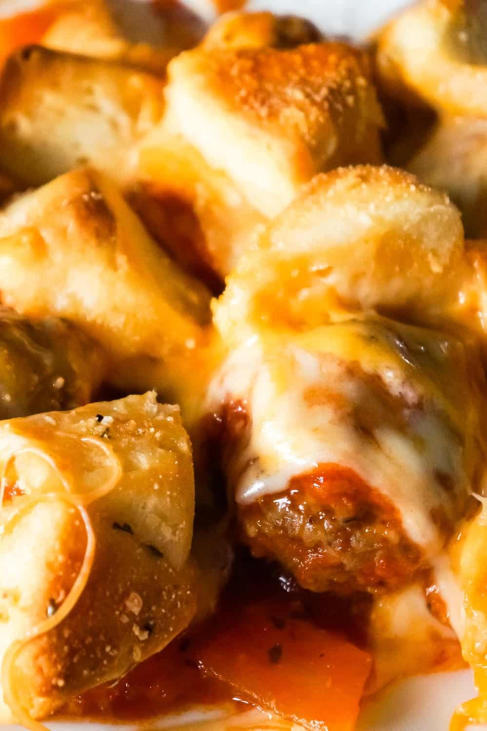 Meatball Casserole with Biscuits is an easy dinner recipe made with frozen meatballs, Pillsbury Biscuits, red and green peppers and loaded with mozzarella and cheddar cheese.