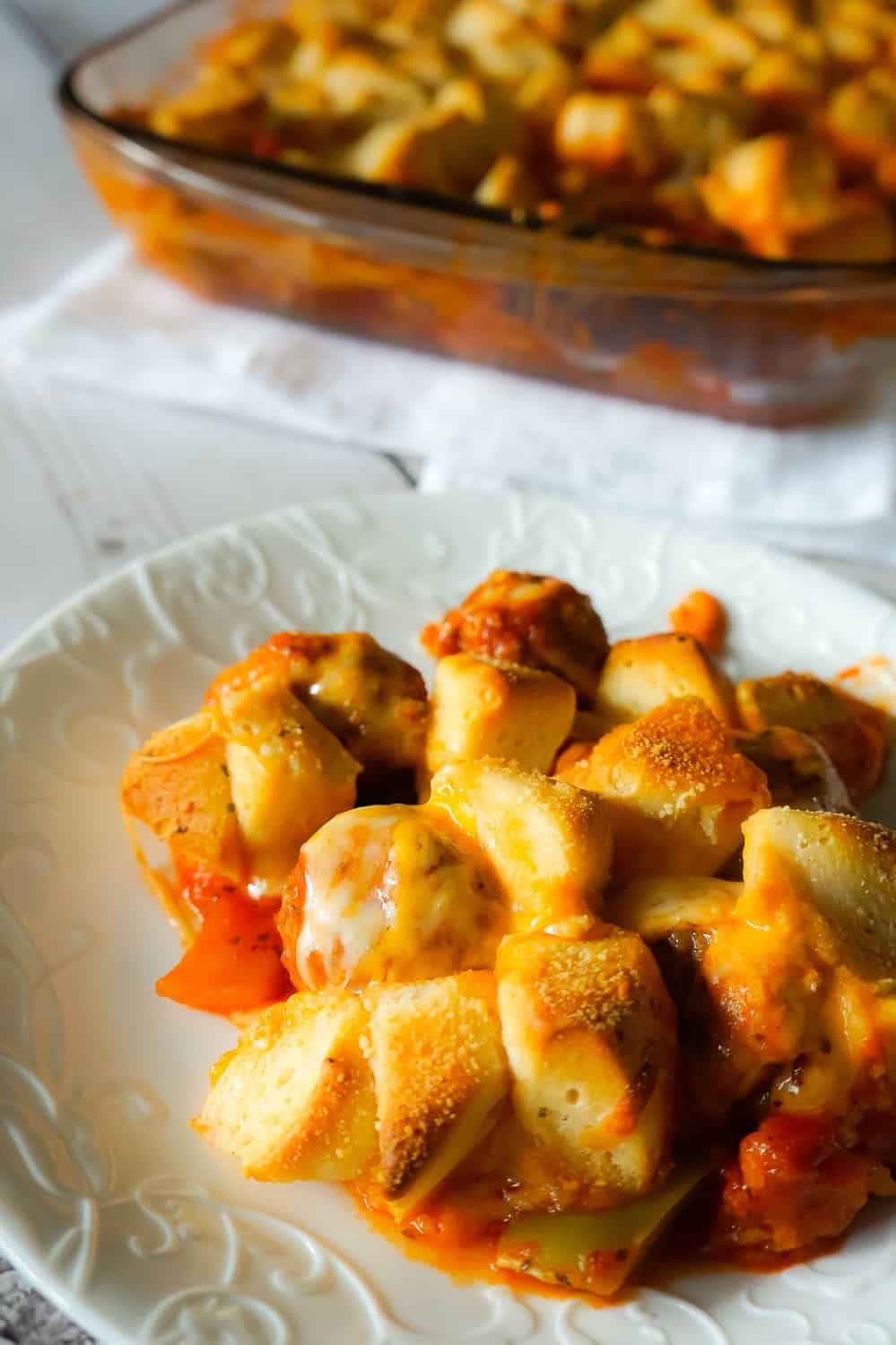 Meatball Casserole with Biscuits is an easy dinner recipe made with frozen meatballs, Pillsbury Biscuits, red and green peppers and loaded with mozzarella and cheddar cheese.