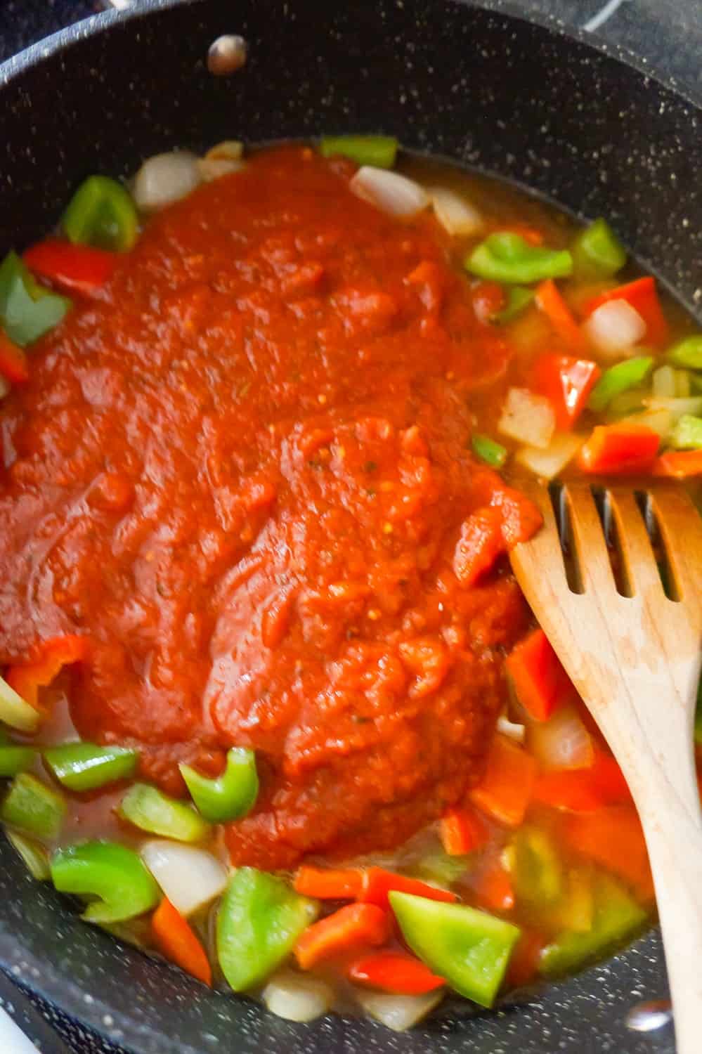 marinara sauce on top diced bell peppers and onions