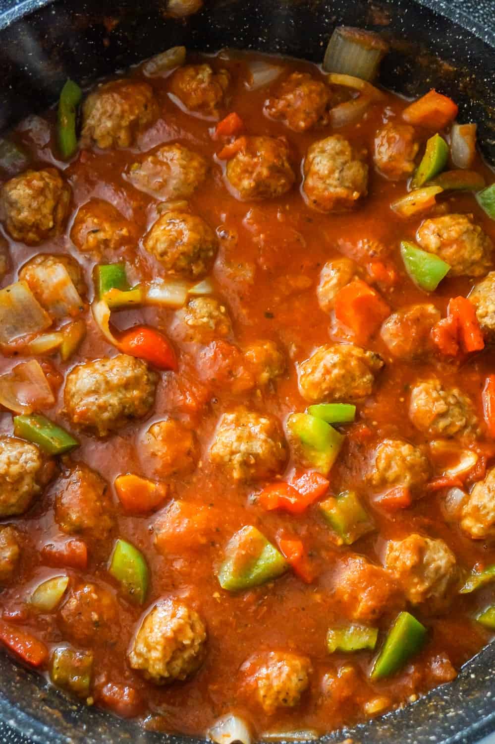 meatballs, marinara and diced bell peppers in a large saute pan