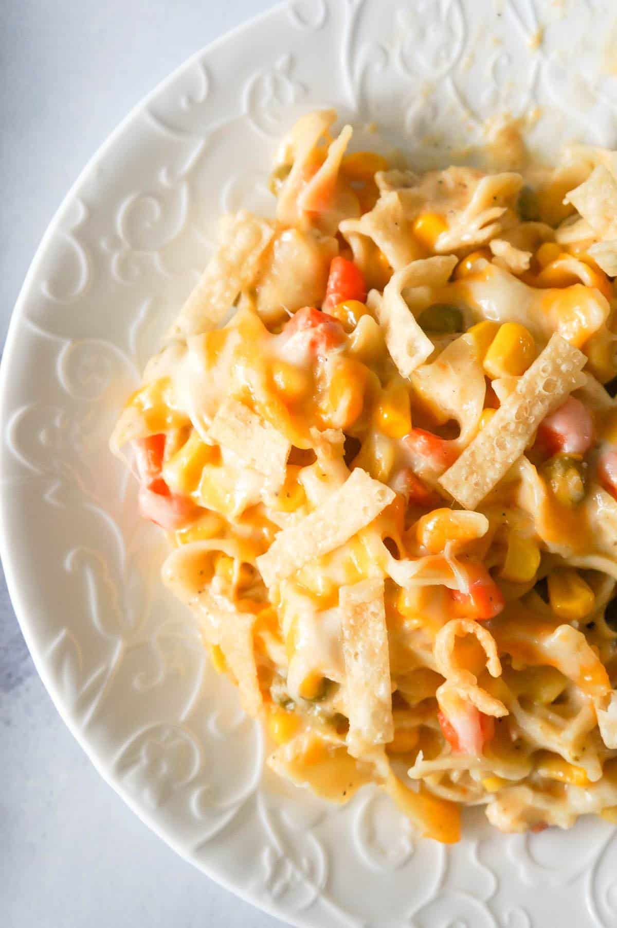 One Pot Chicken Noodle Casserole is a hearty stove top dinner recipe loaded with egg noodles, shredded rotisserie chicken and veggies, topped with cheese and crispy fried Wonton strips.