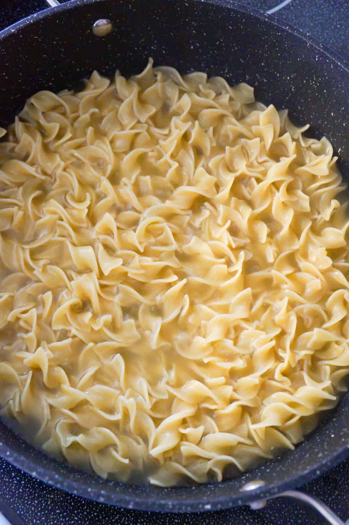 cooked egg noodles in a pot