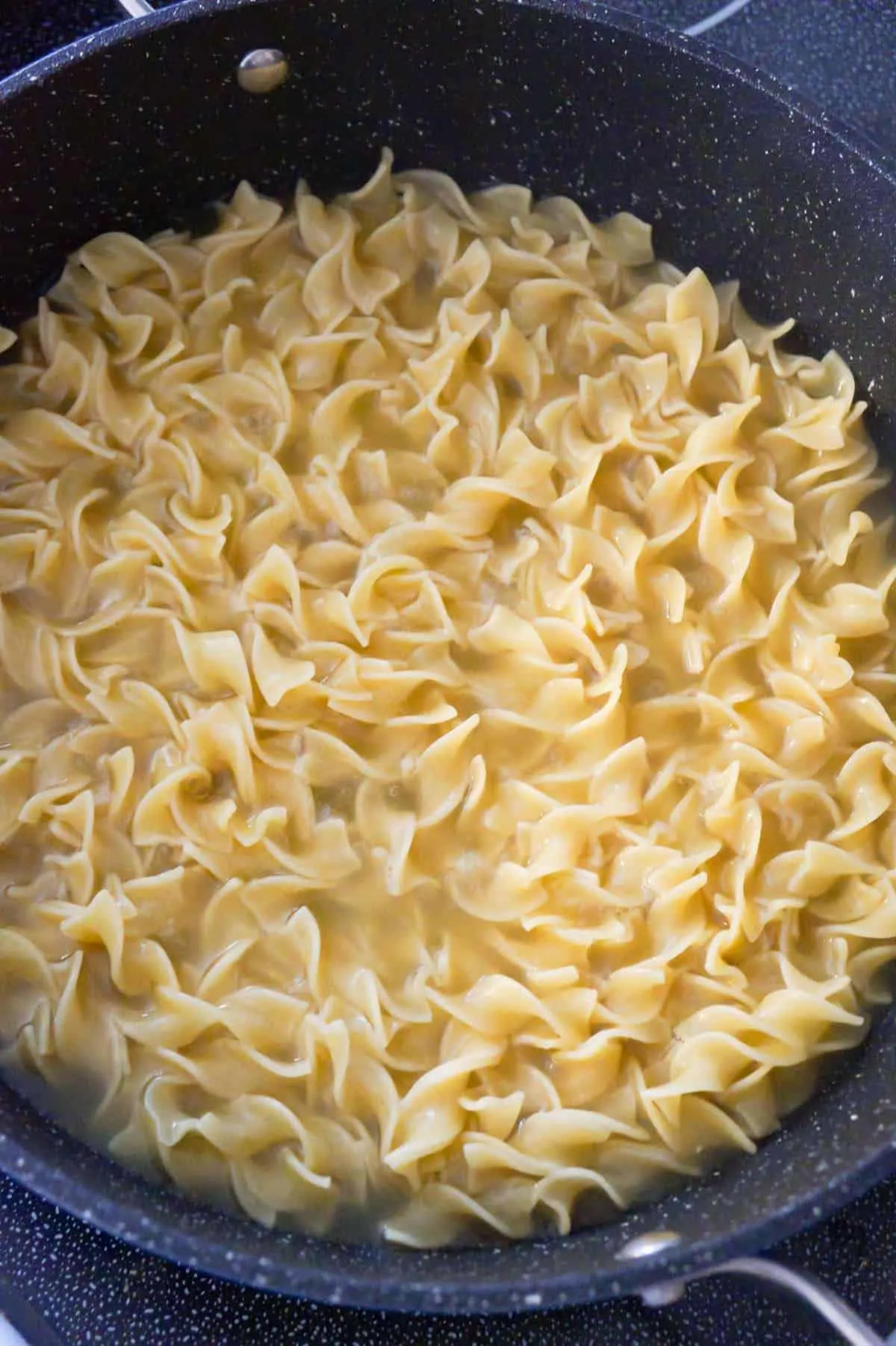 cooked egg noodles in a pot
