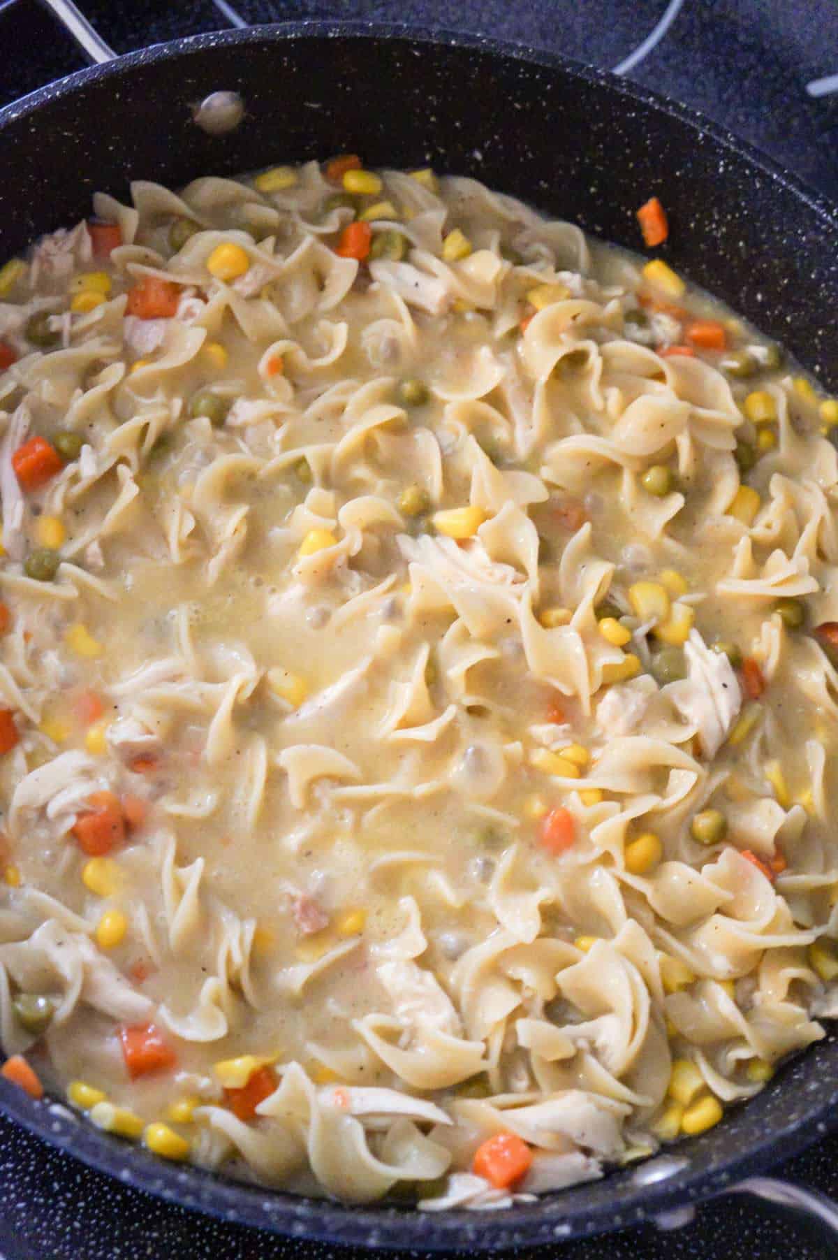 chicken noodle casserole cooking in a pot