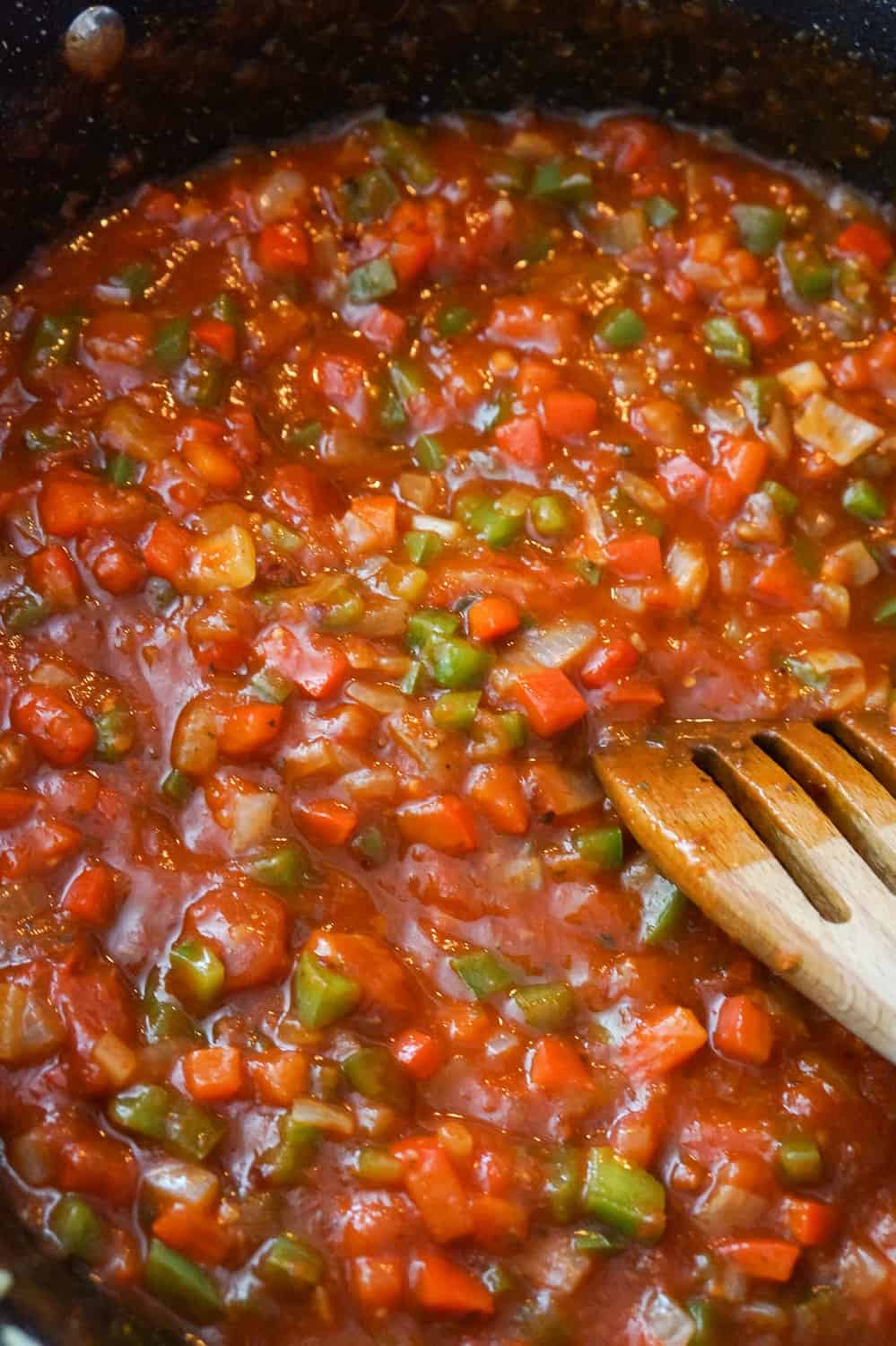 marinara sauce and diced peppers in a saute pan