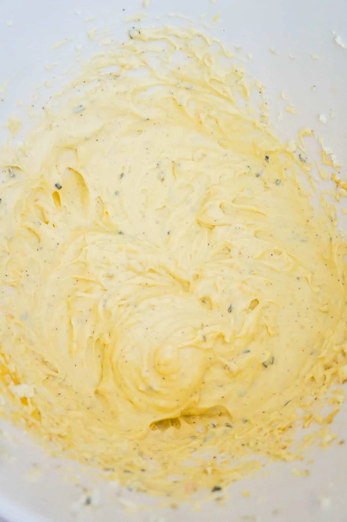 cream of chicken soup and cream cheese mixture in a mixing bowl