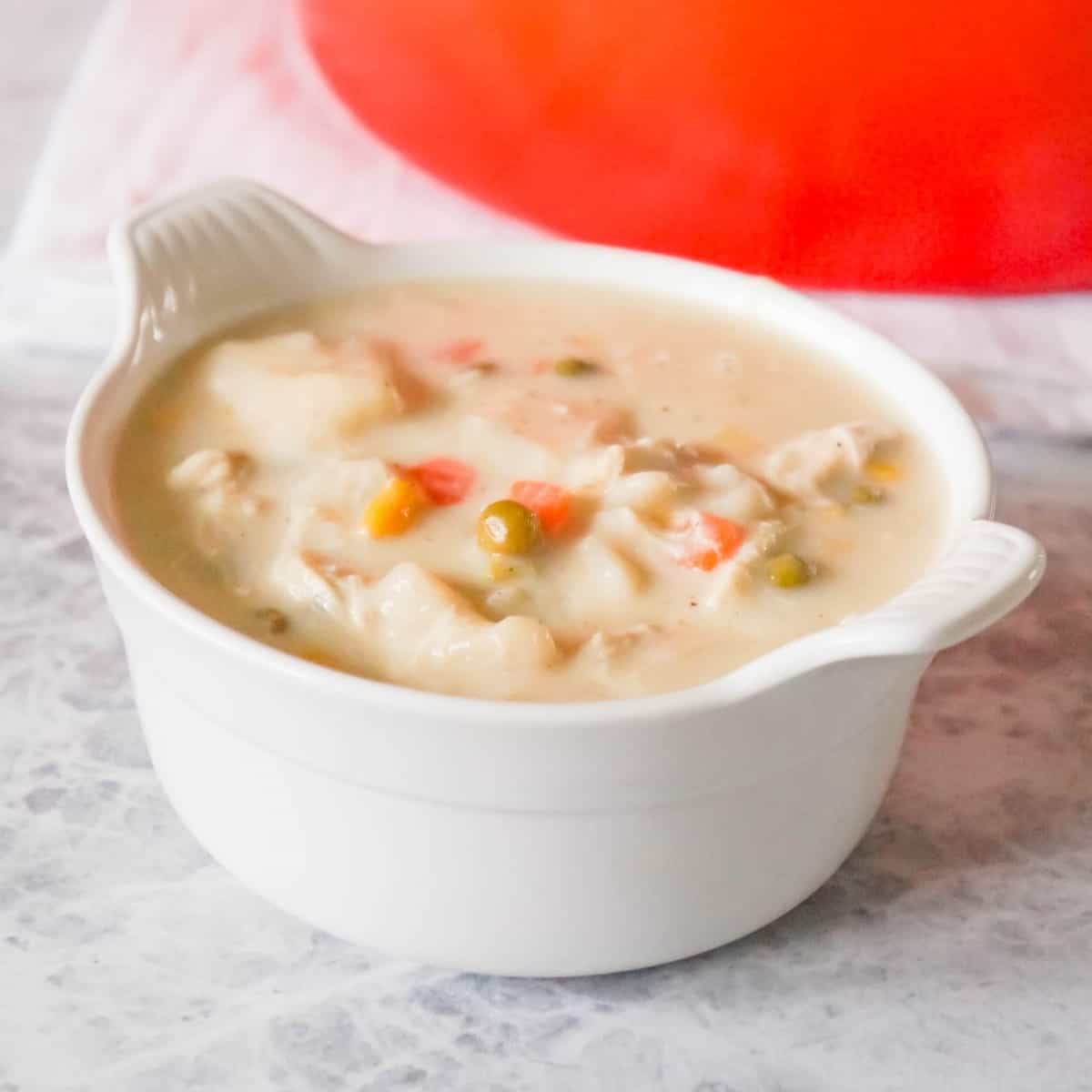 Chicken and Dumplings Soup is a hearty soup recipe using shredded rotisserie chicken, loaded with veggies and Pillsbury biscuit dumplings.