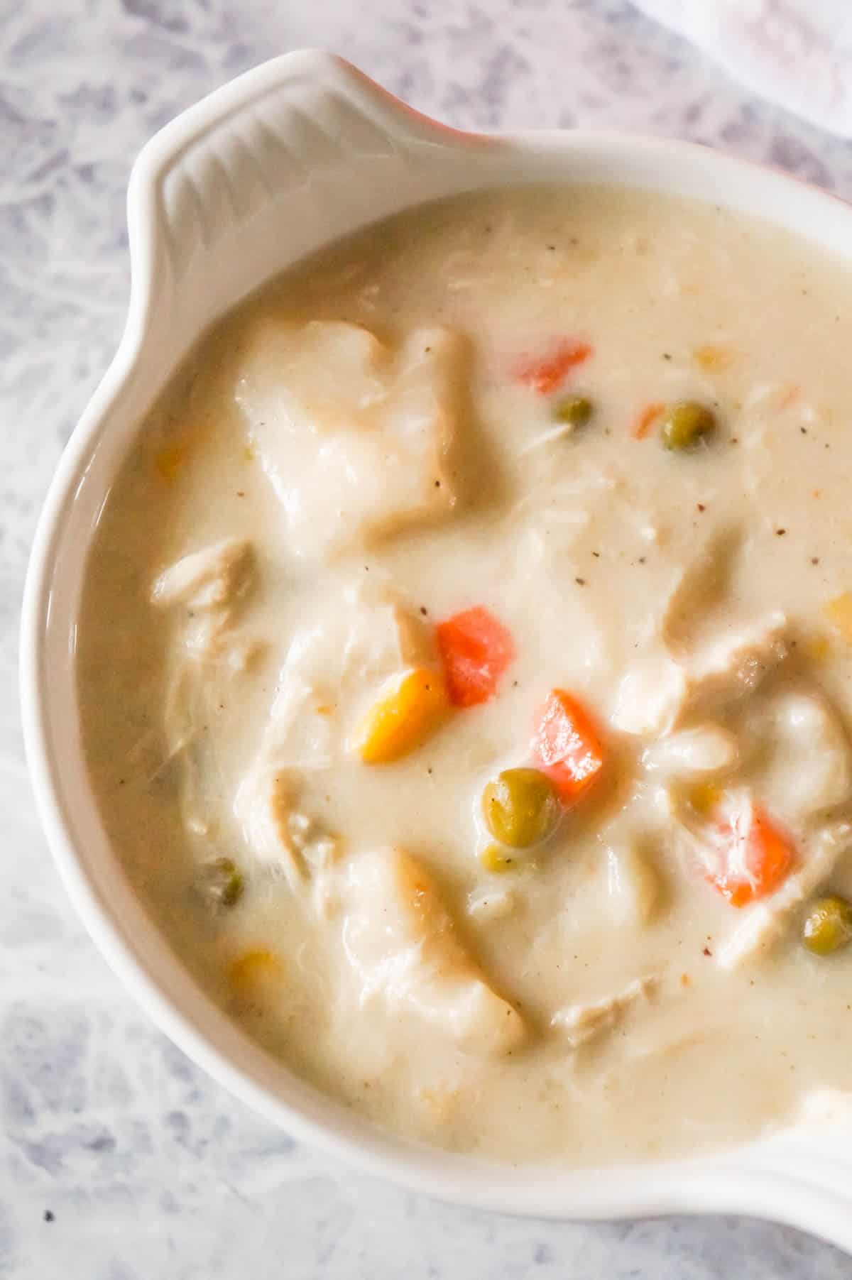 Chicken and Dumplings Soup is a hearty soup recipe using shredded rotisserie chicken, loaded with veggies and Pillsbury biscuit dumplings.