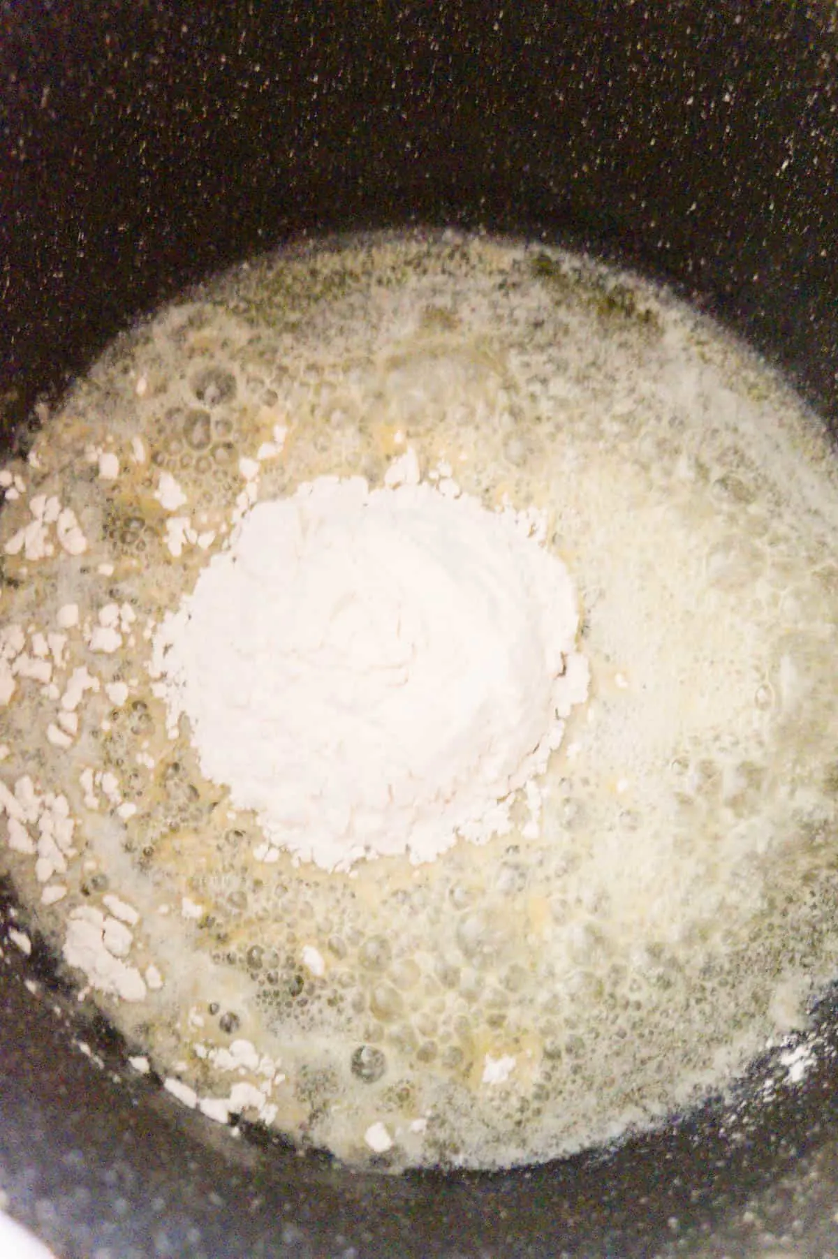 all purpose flour on top of melted butter in a large pot