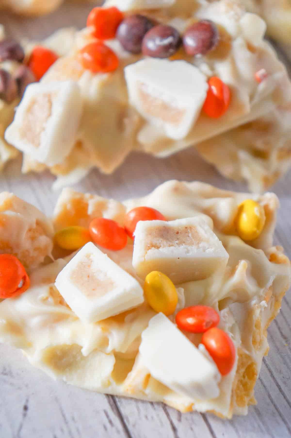 Fritos White Chocolate Peanut Butter Cup Bark is a sweet and salty dessert recipe made with white chocolate chips, Fritos corn chips, mini white chocolate Reese's peanut butter cups and mini Reese's pieces.