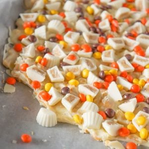 Fritos White Chocolate Peanut Butter Cup Bark is a sweet and salty dessert recipe made with white chocolate chips, Fritos corn chips, mini white chocolate Reese's peanut butter cups and mini Reese's pieces.