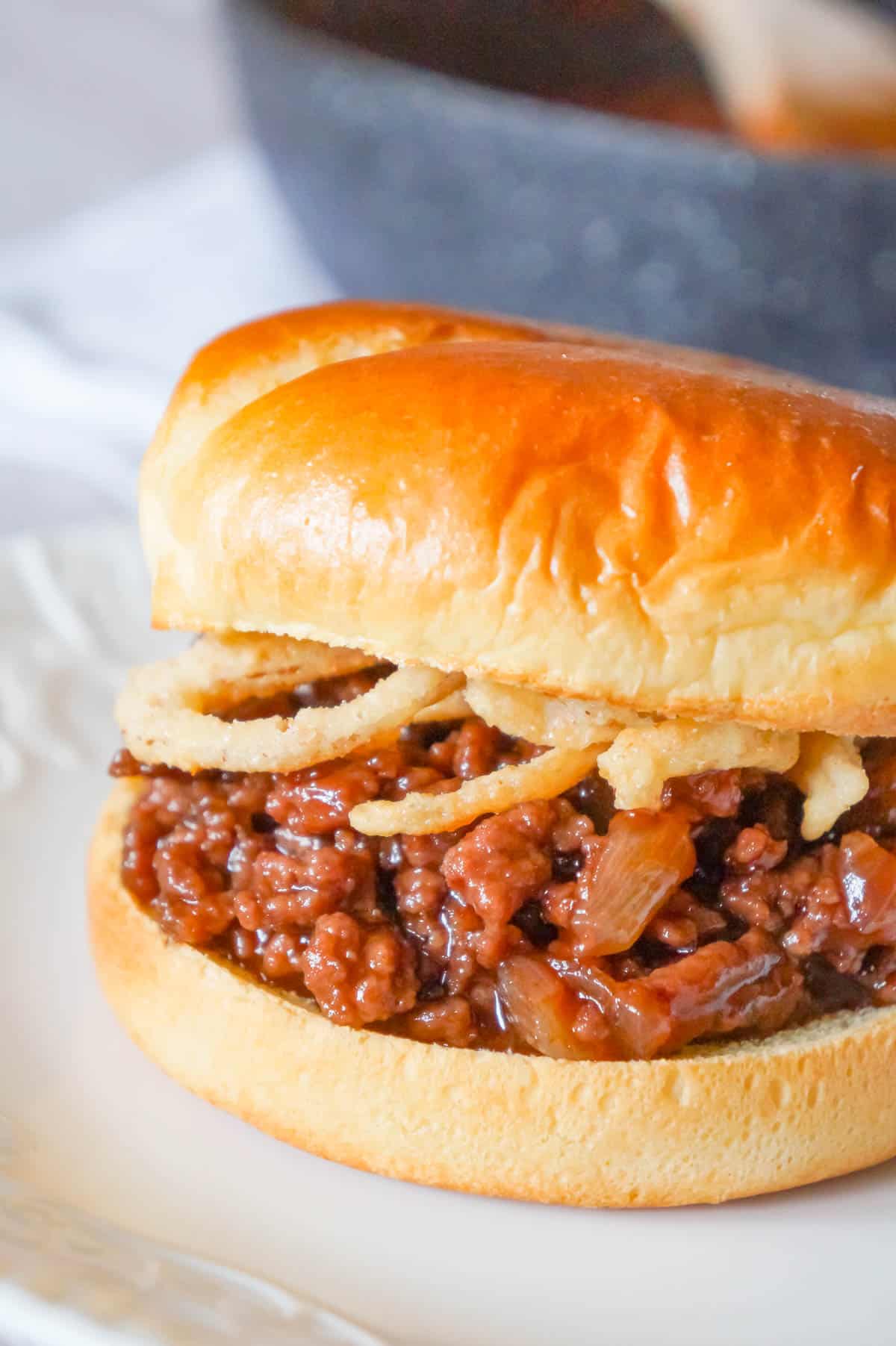 Grape Jelly BBQ Sloppy Joes are a fun twist on the classic sandwich. These tasty sloppy joes are made with ground beef tossed in a mixture of grape jelly and BBQ sauce and topped with French's crispy fried onions.