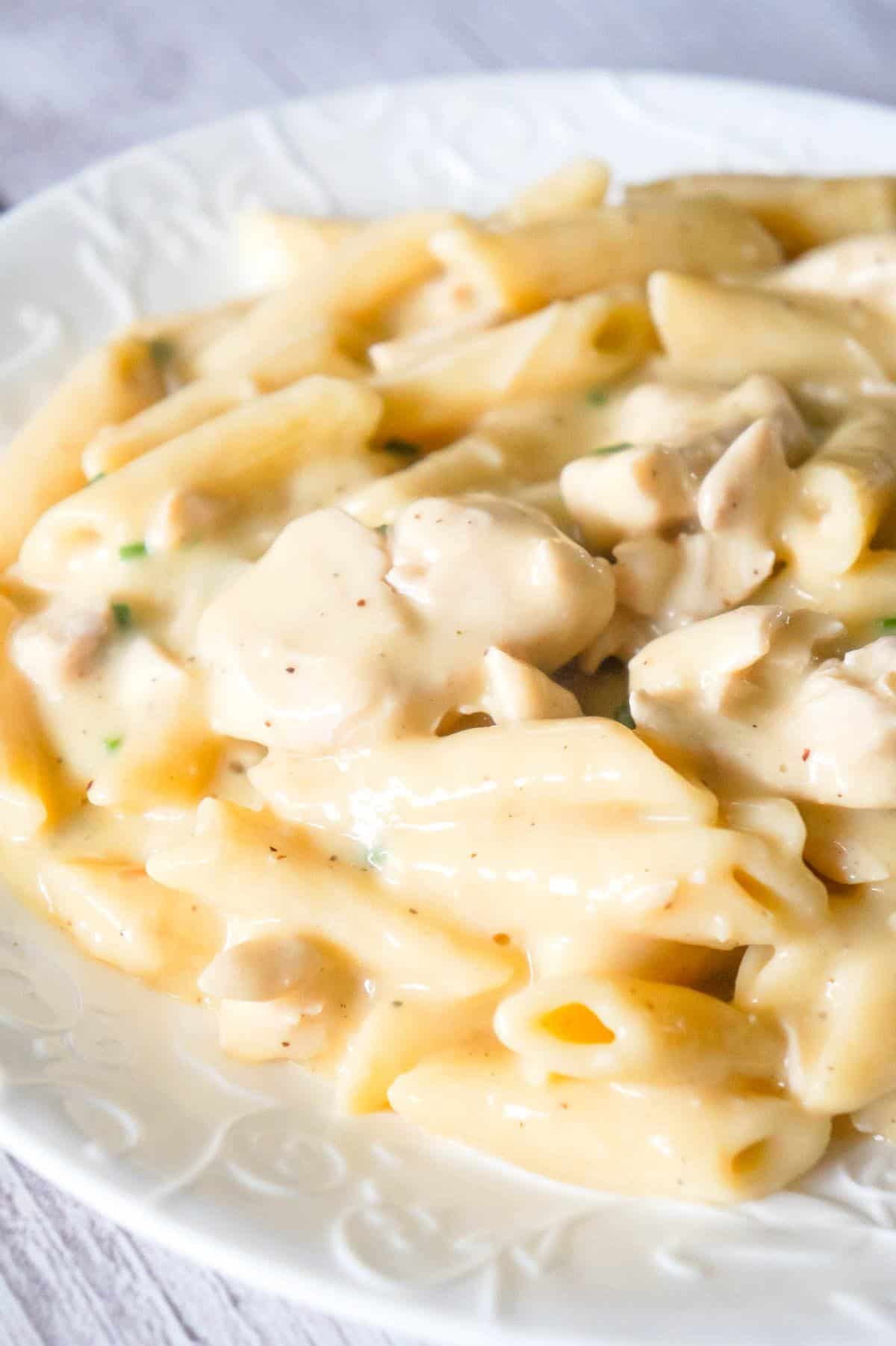 Instant Pot Garlic Parmesan Chicken and Pasta is a delicious pressure cooker pasta recipe loaded with chunks of chicken breast in a creamy Parmesan cheese sauce.