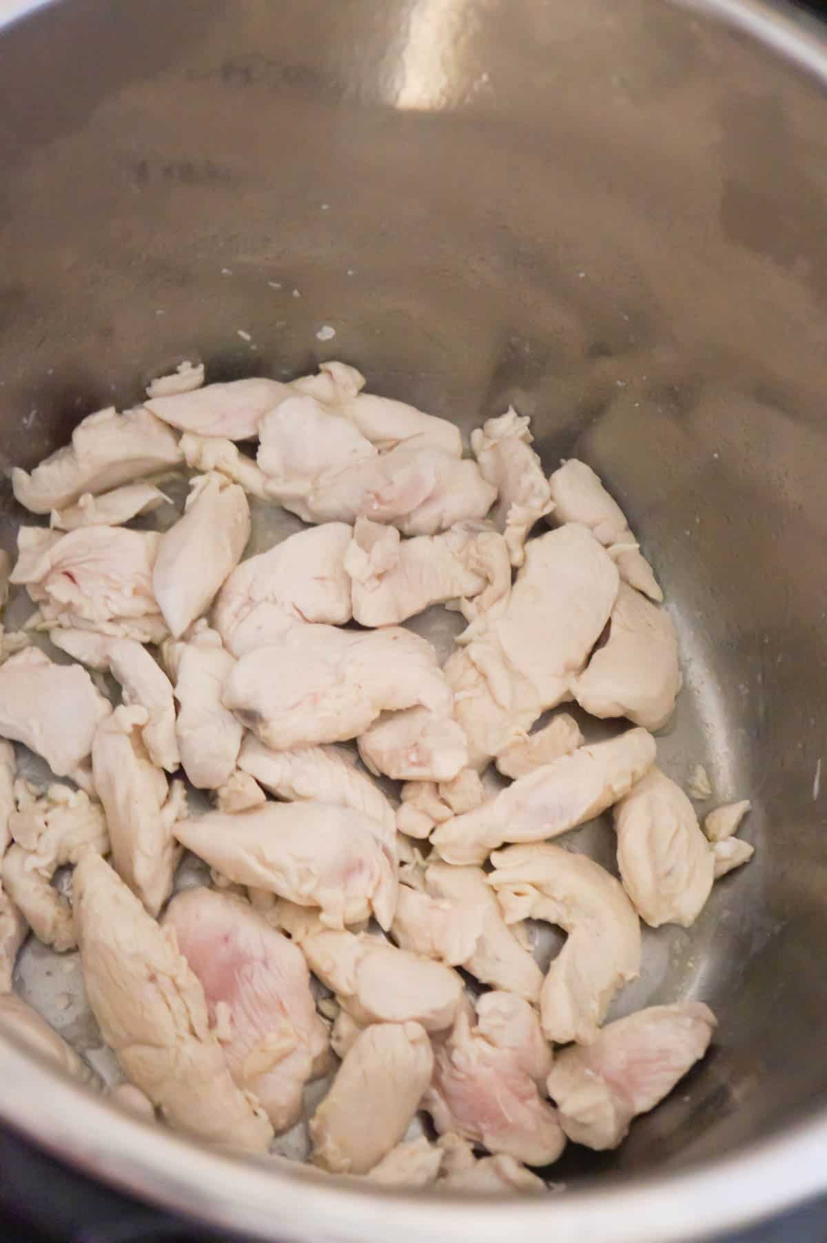 chicken breast strips cooking in an Instant Pot