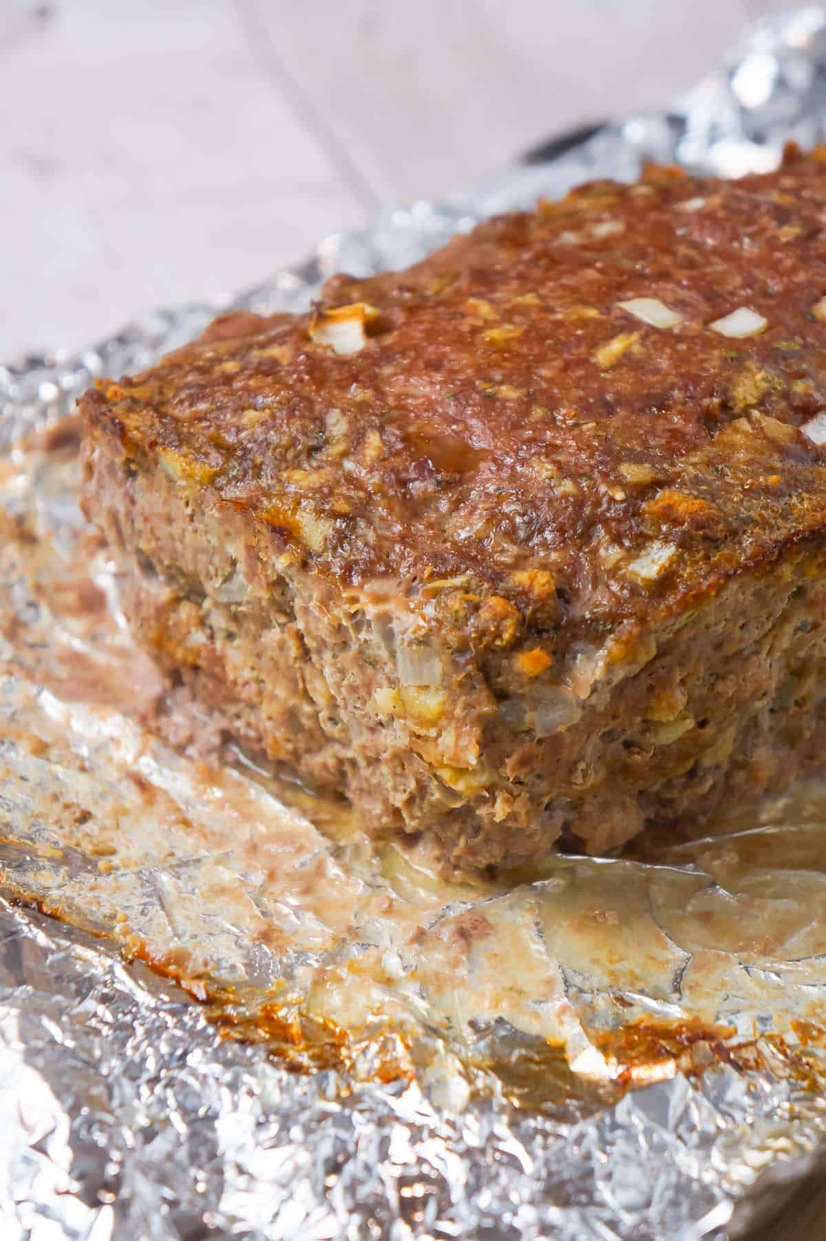 Meatloaf with Gravy is an easy 2 pound ground beef meatloaf recipe made with Stove Top stuffing mix and served with homemade gravy.