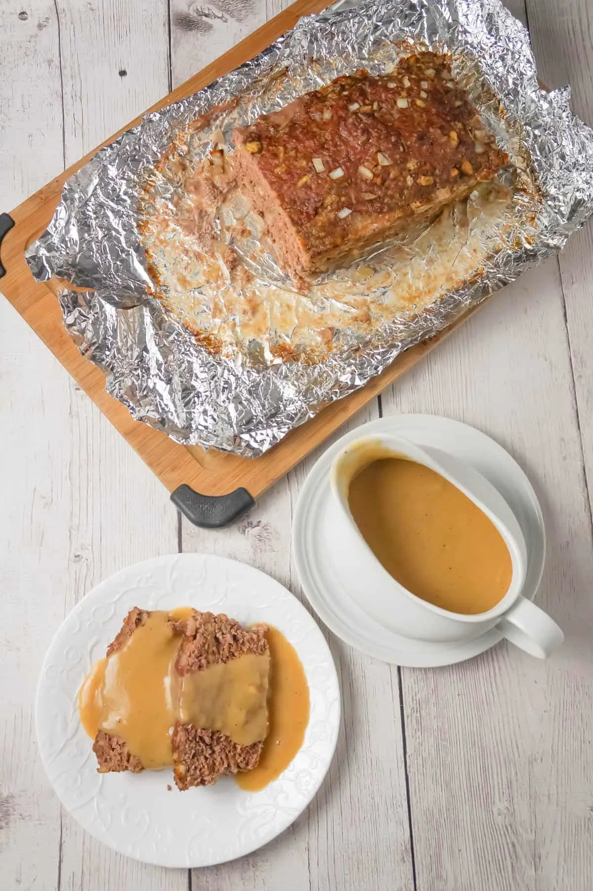 Meatloaf with Gravy is an easy 2 pound ground beef meatloaf recipe made with Stove Top stuffing mix and served with homemade gravy.