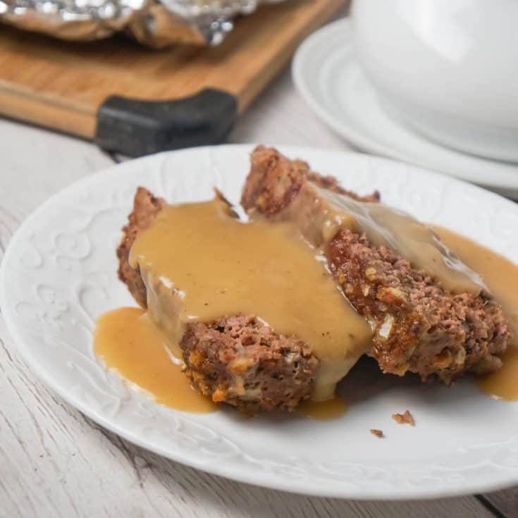 Meatloaf with Gravy is an easy 2 pound ground beef meatloaf recipe made with Stove Top stuffing mix and served with homemade gravy.