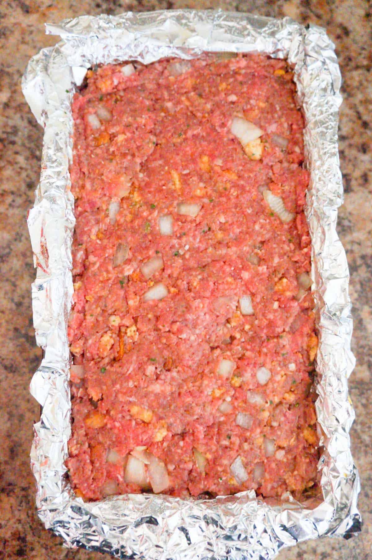 meatloaf mixture in a loaf pan before cooking