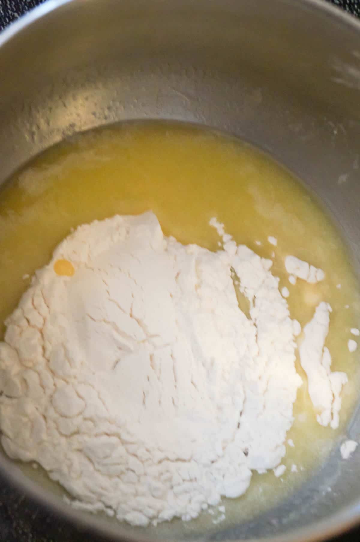 all purpose flour on top of melted butter in a saucepan