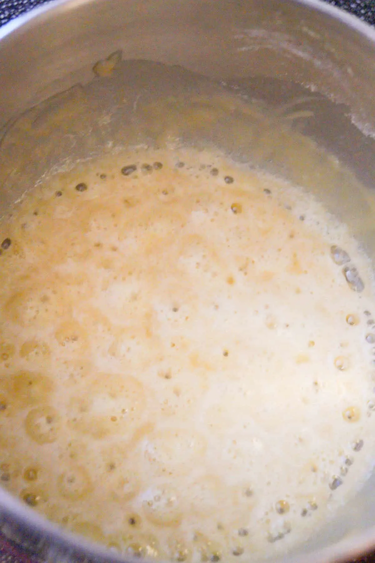 flour and butter mixture cooking in a sauce pan